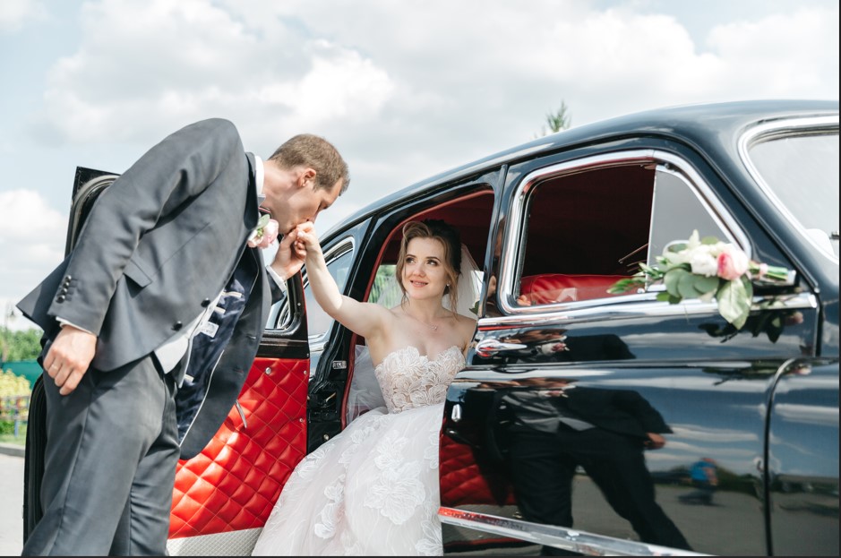 groom kisses his beloved hand